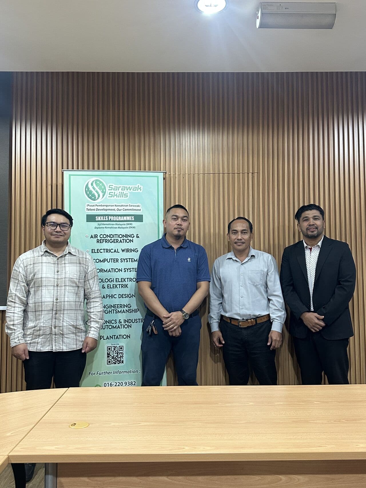 3D Gens team poses with Sarawak Skills representatives in front of the Sarawak Skills programme banner during a partnership discussion